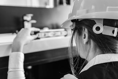 Rear view of engineer working at construction site