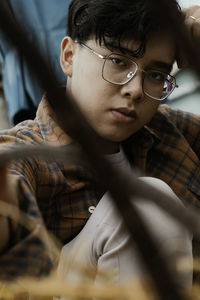 Portrait of young man wearing eyeglasses