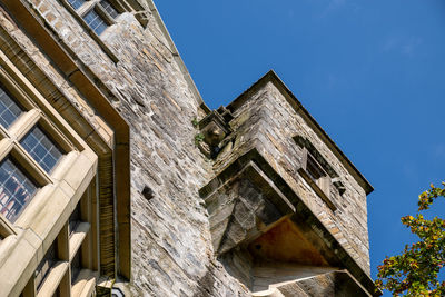 Low angle view of building against blue sky