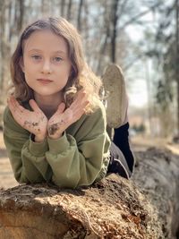 Portrait of cute girl with tree