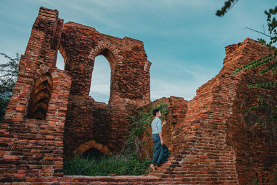 Low angle view of man climbing stairs 