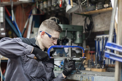 Plumber male working in a workshop