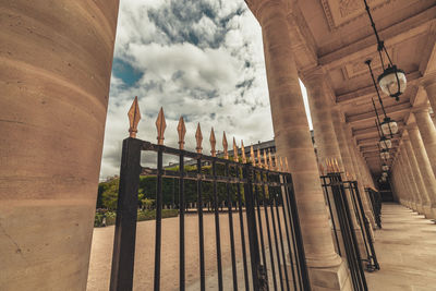 Low angle view of building against cloudy sky