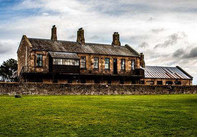 Old building by field 