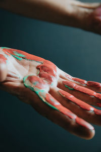 Cropped hand of person with paint