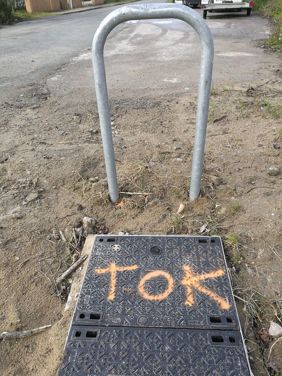 HIGH ANGLE VIEW OF TEXT ON STREET AT PLAYGROUND