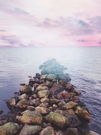 Scenic view of sea against sky at sunset