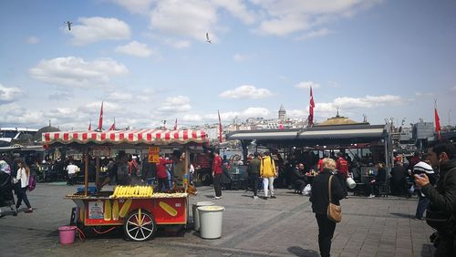 People on street against sky