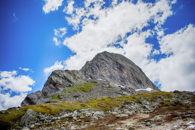 Low angle view of rock formation against sky