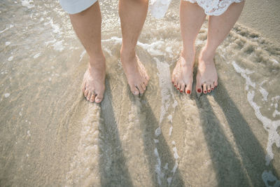 Low section of people on beach