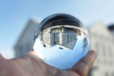 Close-up of person holding a sphere of glass - greifswald's theater