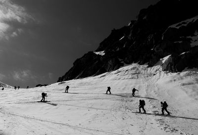 Tourists enjoying on snow covered mountain