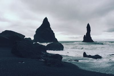 Scenic view of sea against cloudy sky