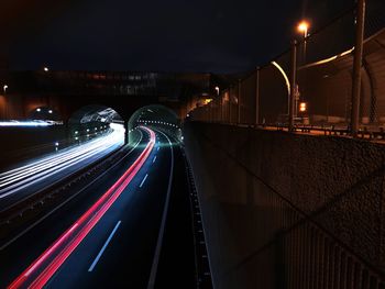 High angle view of light trails on road at night