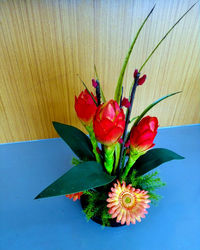 Close-up of red flower on table