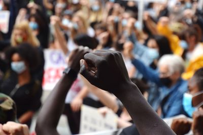 Group of people holding hands in city