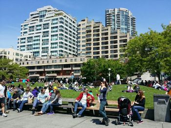 High angle view of people sitting in city