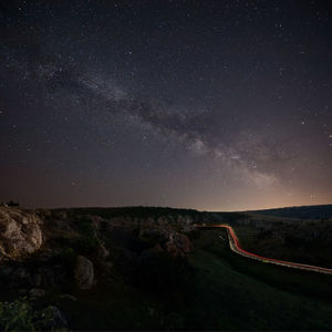 Scenic view of star field against sky at night