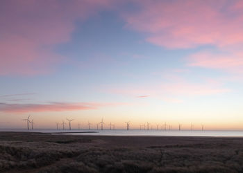 Scenic view of landscape against sky during sunset