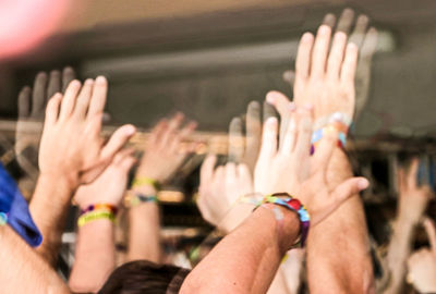 Cropped image of people hands during party