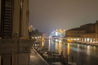 Illuminated city at waterfront