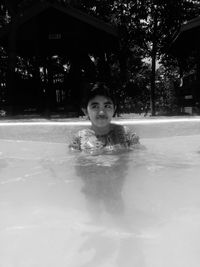 Portrait of smiling boy in swimming pool