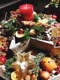 High angle view of christmas decorations and food on table