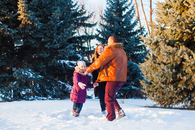 Full length of woman standing on snow