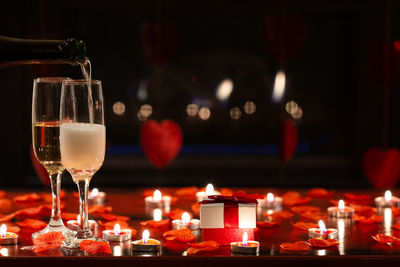Close-up of wine glasses on table