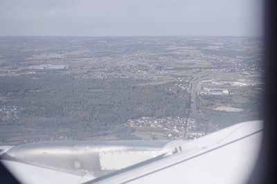 Aerial view of landscape seen through airplane window