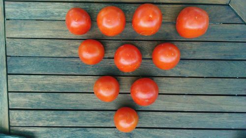 Red tomatoes on wooden table