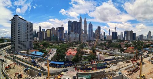 Panoramic view of city buildings against sky