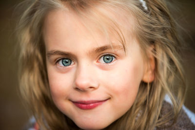 Close-up of cute girl with blue eyes