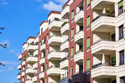 Low angle view of buildings against blue sky