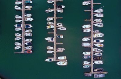 High angle view of boats moored in row