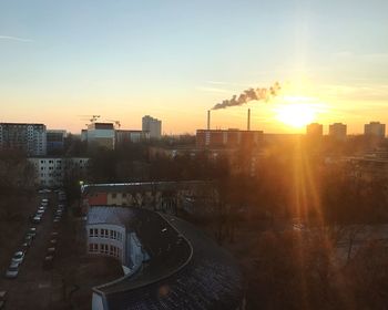 High angle view of buildings against sky during sunset