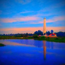 Scenic view of lake against cloudy sky