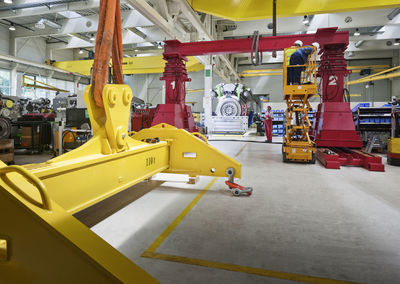 Industry, workers working with indoor crane