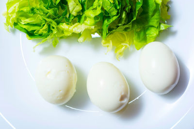 High angle view of eggs in plate