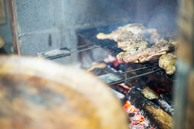 Close-up of meat on barbecue grill