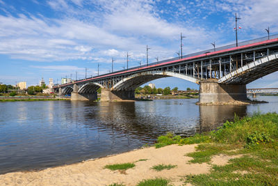 Bridge over river against sky