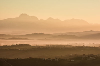 Scenic view of mountains against dramatic sky