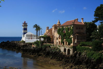 View of sea with buildings in background