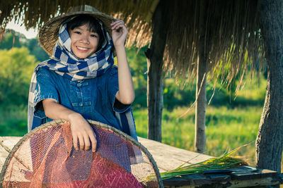 Portrait of smiling girl standing on grass