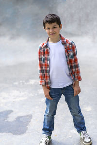 Teenager boy standing outdoors