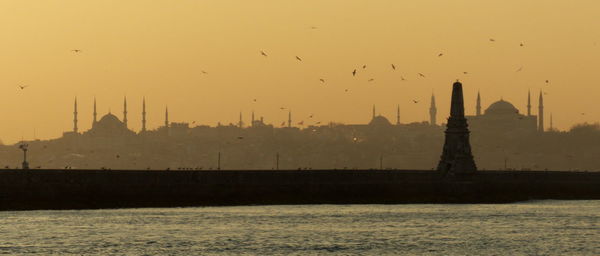 Silhouette of buildings at sunset
