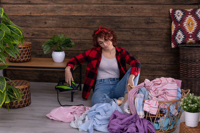 Portrait of young woman standing at market