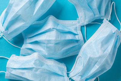 Close-up of clothes hanging over blue background