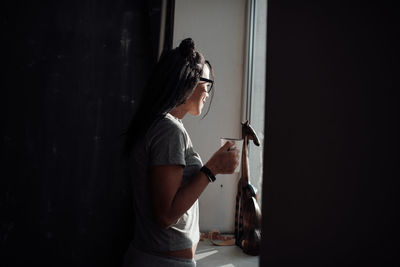 Woman looking at camera at home