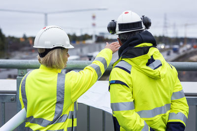 People talking on building site